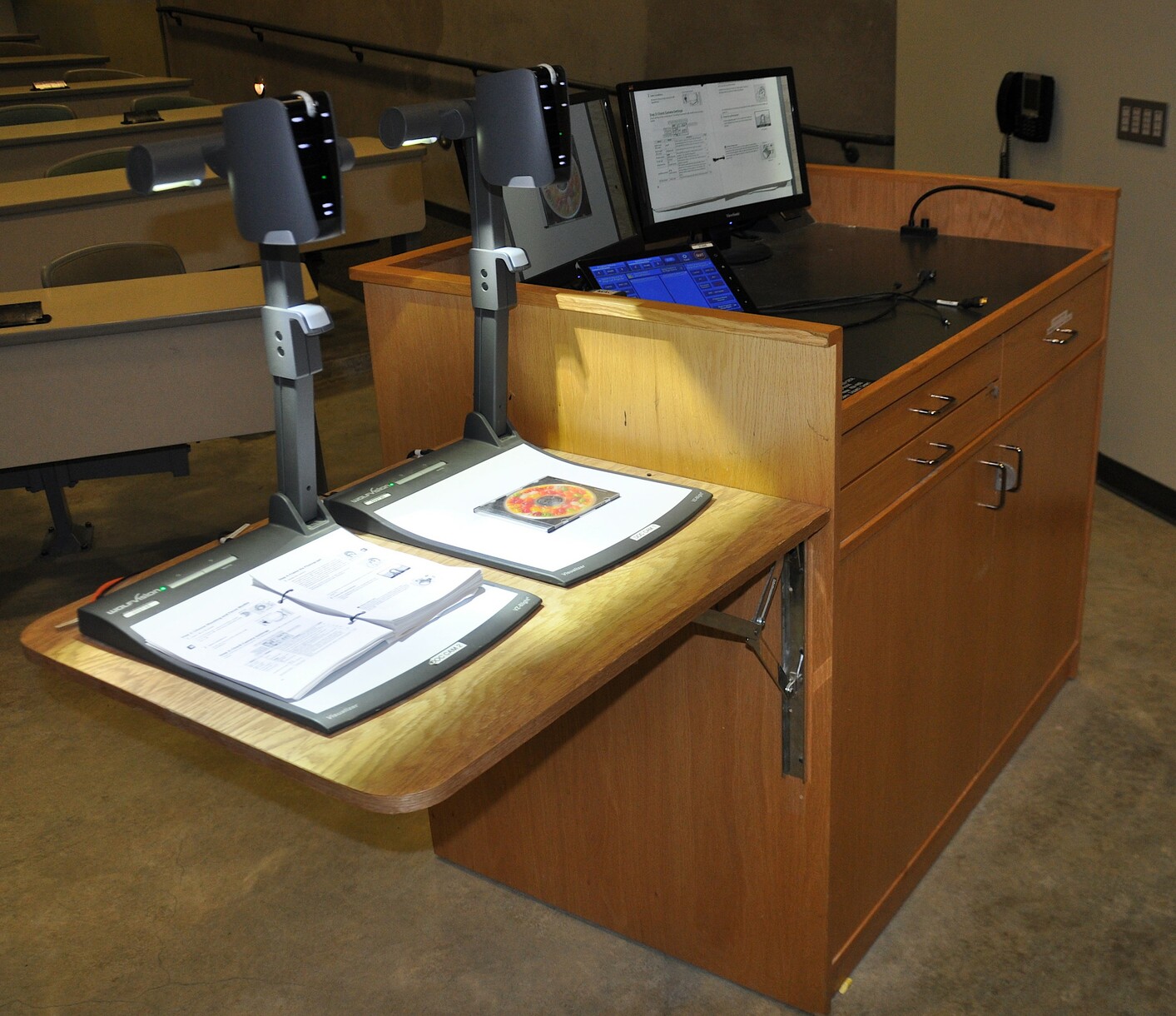 Twin WolfVision VZ.8light4  Visualizers located on the side of a lectern in a large lecture hall at UCSC.