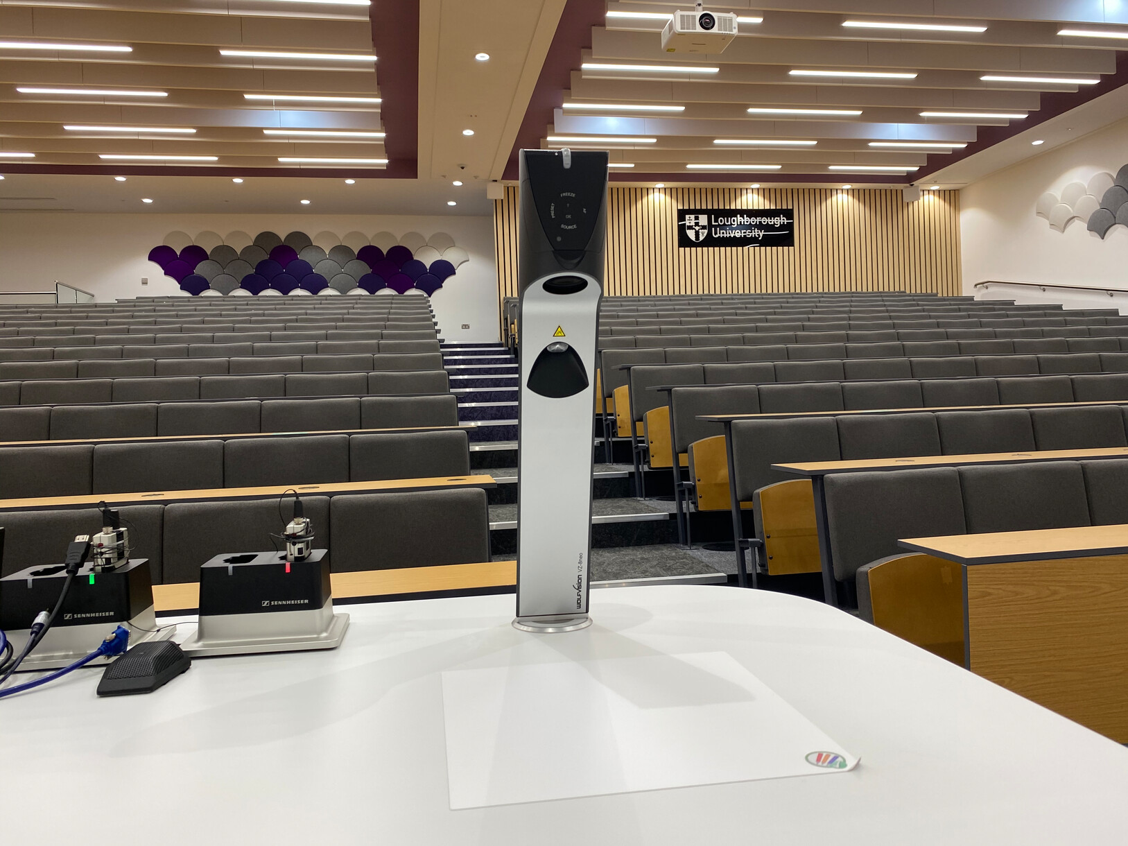 Self-adhesive, dry-erase working surfaces attached directly to the lectern offer a non-reflective “digital whiteboard” surface.